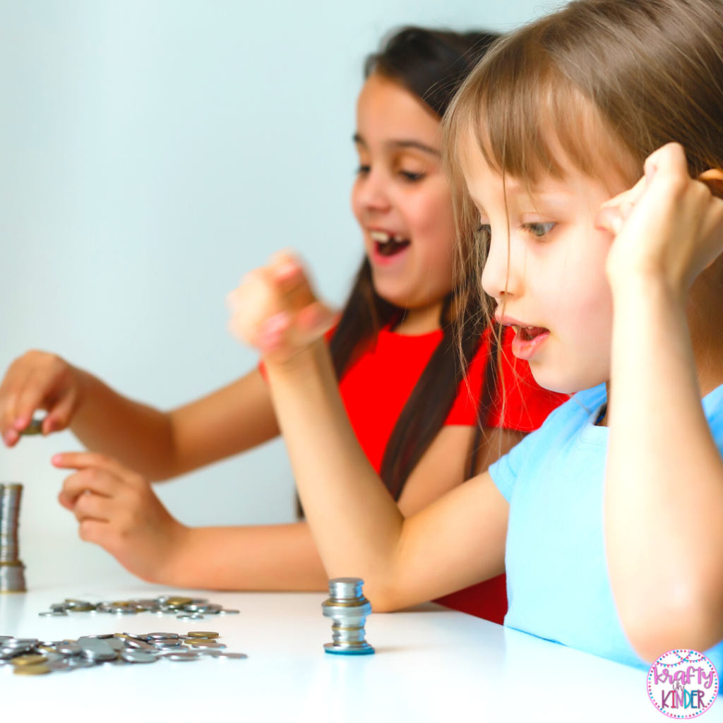 Students counting money for the 100th Day of School.