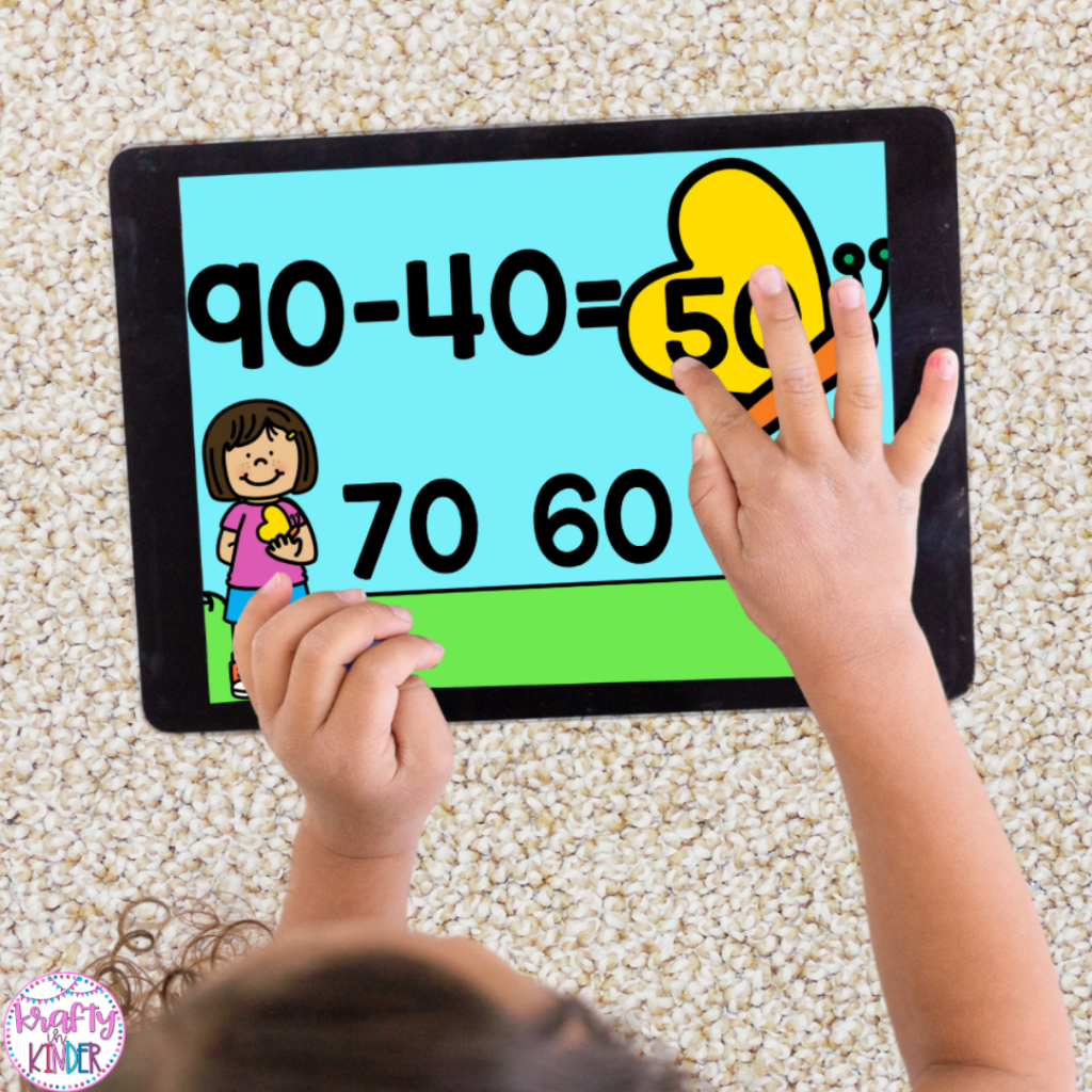 In this picture, a student is completing a subtraction activity on an iPad. The activity focuses on subtracting multiples of ten. 