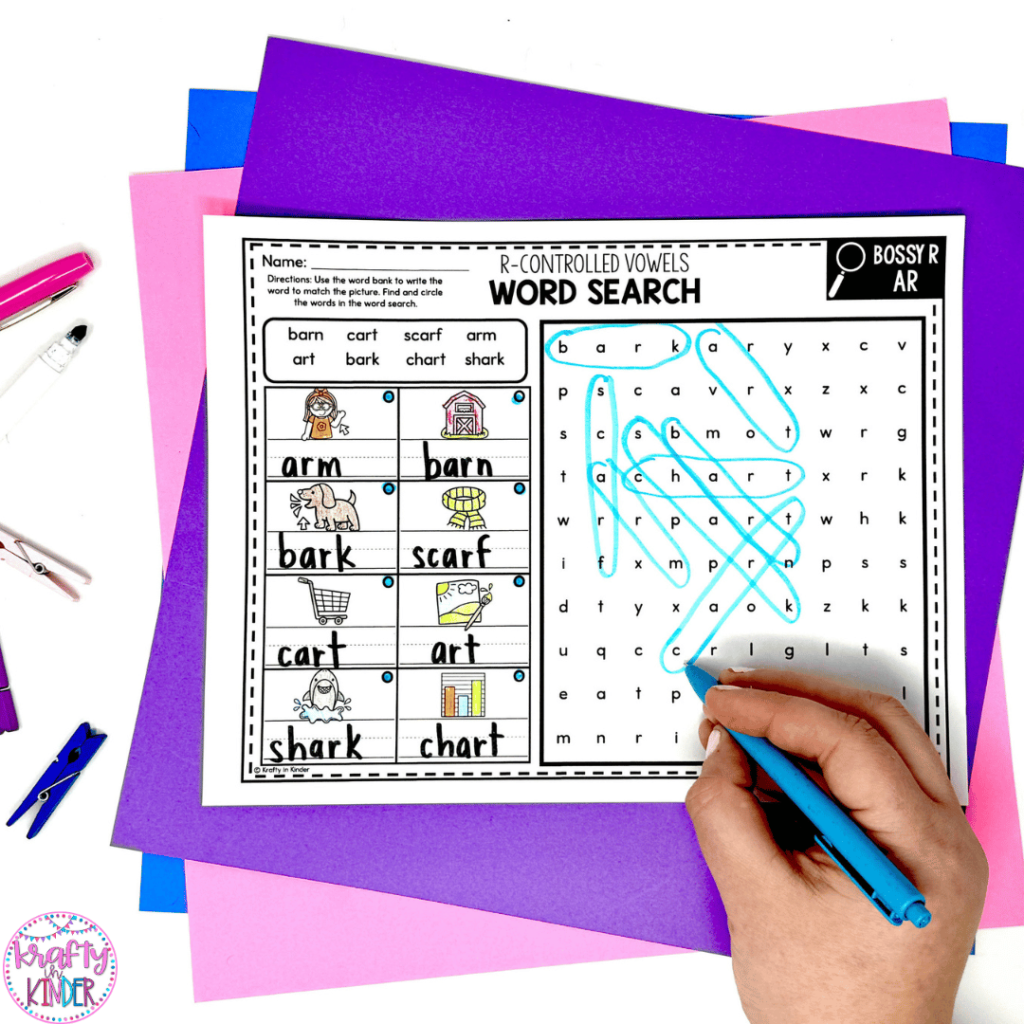 In this image, a student is completing a phonics skills word search. On the worksheet, there is a word bank, a place for students to match words with corresponding pictures and a place to find the words in a word search puzzle.